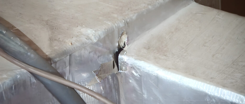 How Wisconsin Ductwork Drives Up Energy Bills 3 ducting with a hole leaking air.